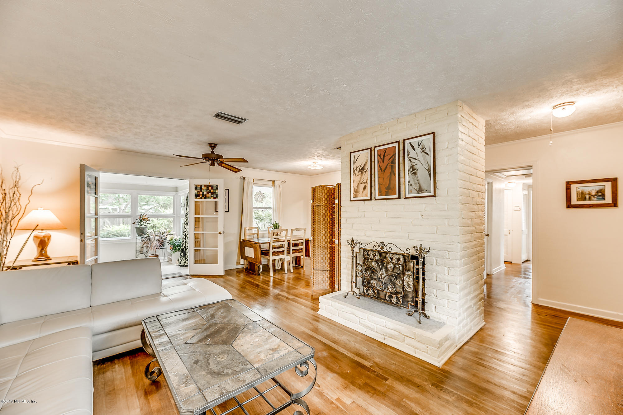 6403 Wesleyan Road Jacksonville, FL 32217 - Photo 16 of 37 a living room with furniture and a table