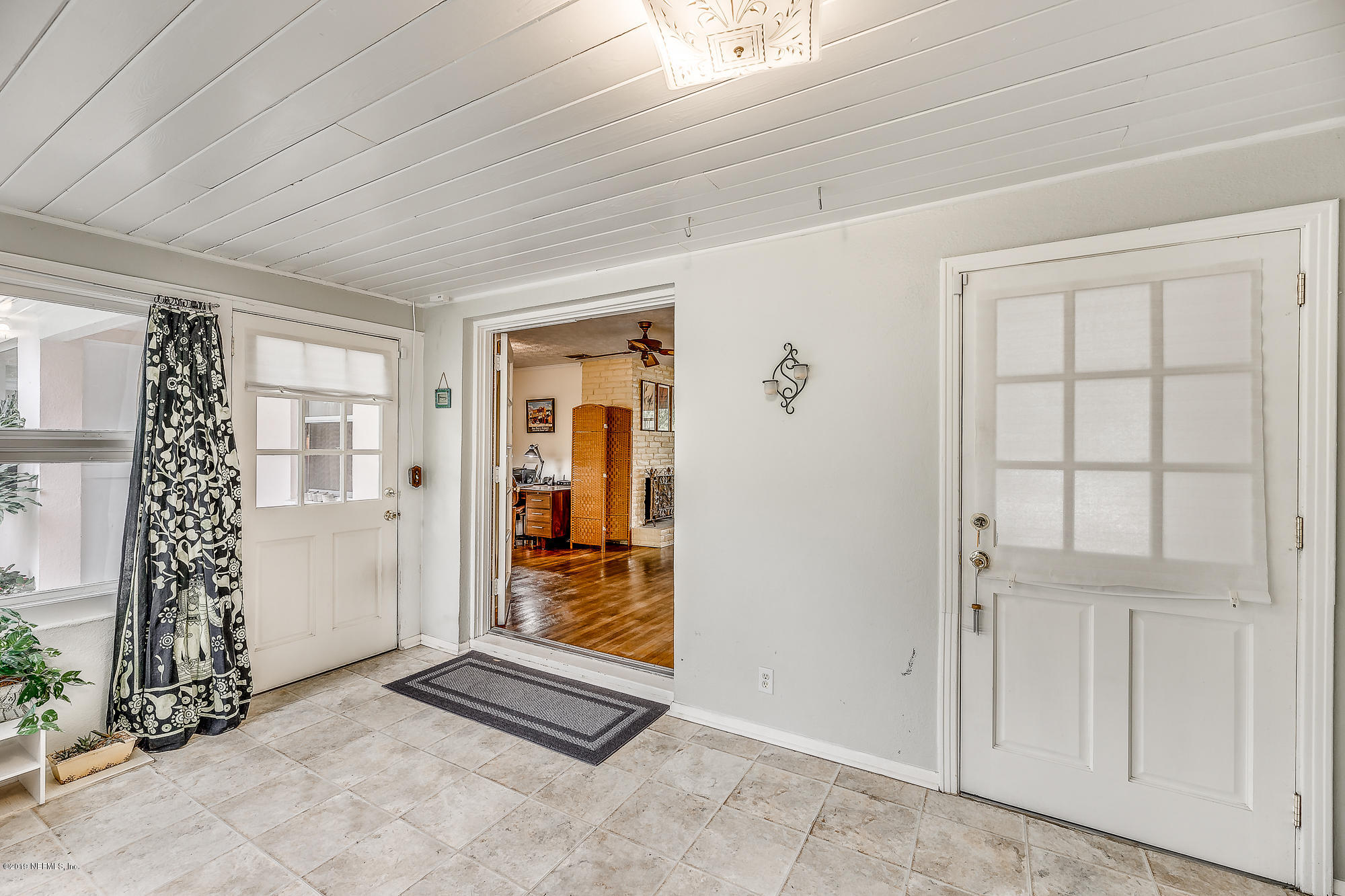 6403 Wesleyan Road Jacksonville, FL 32217 - Photo 23 of 37 an empty room with windows