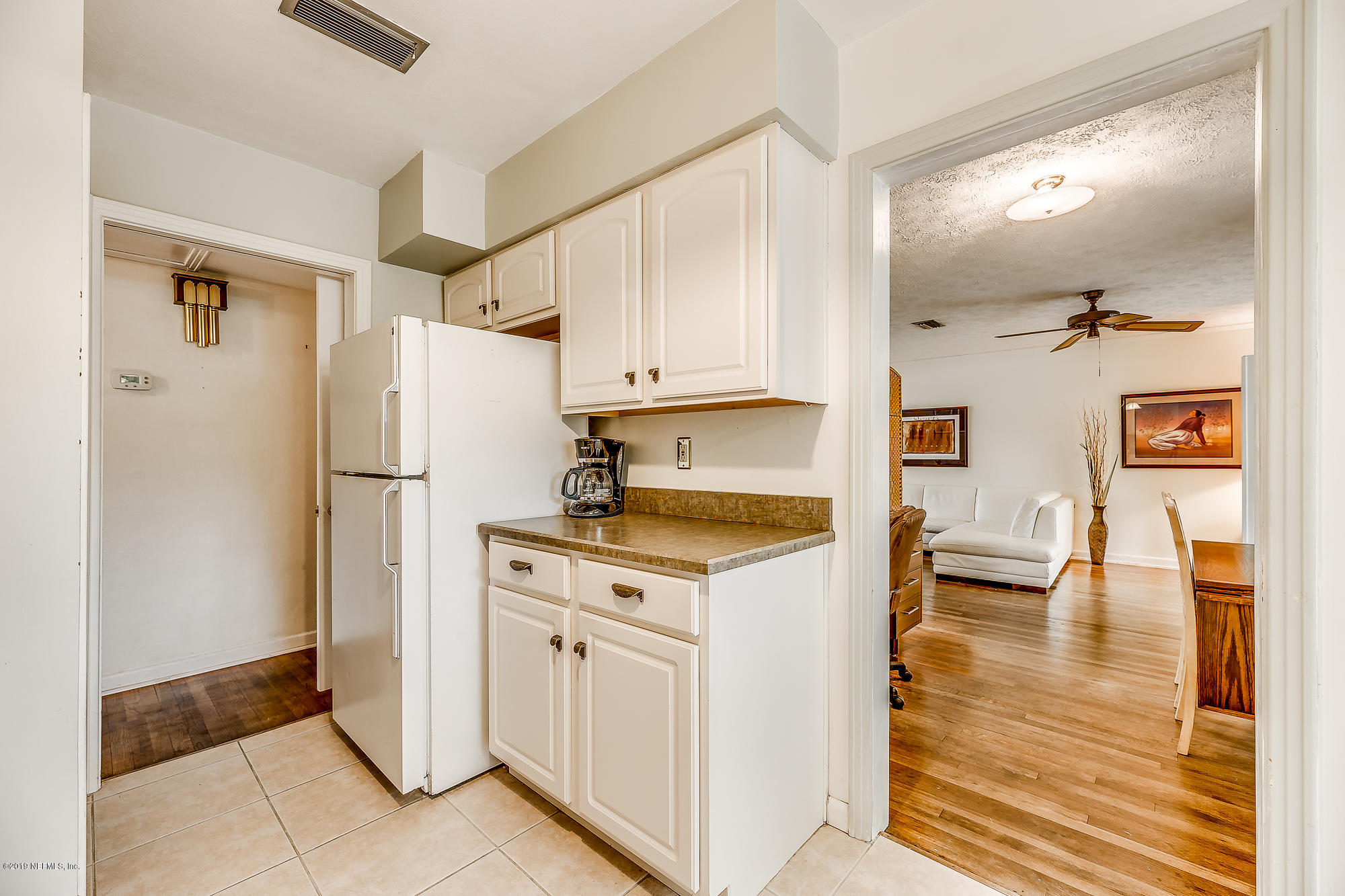 6403 Wesleyan Road Jacksonville, FL 32217 - Photo 27 of 37 a kitchen with stainless steel appliances granite countertop a refrigerator a stove and a sink