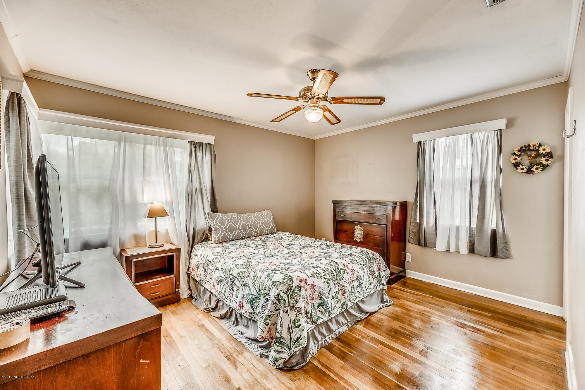6403 Wesleyan Road Jacksonville, FL 32217 - Photo 33 of 37 a bedroom with a bed dresser and a window