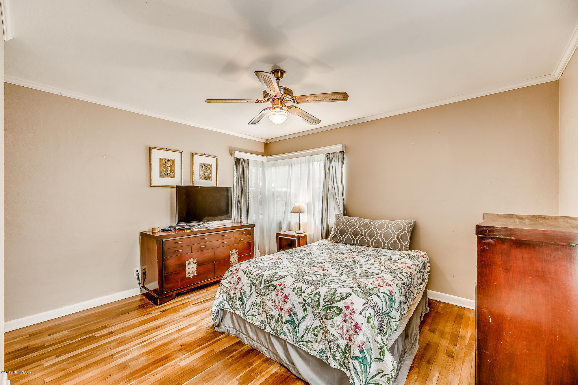 6403 Wesleyan Road Jacksonville, FL 32217 - Photo 36 of 37 a bedroom with a bed and a flat screen tv