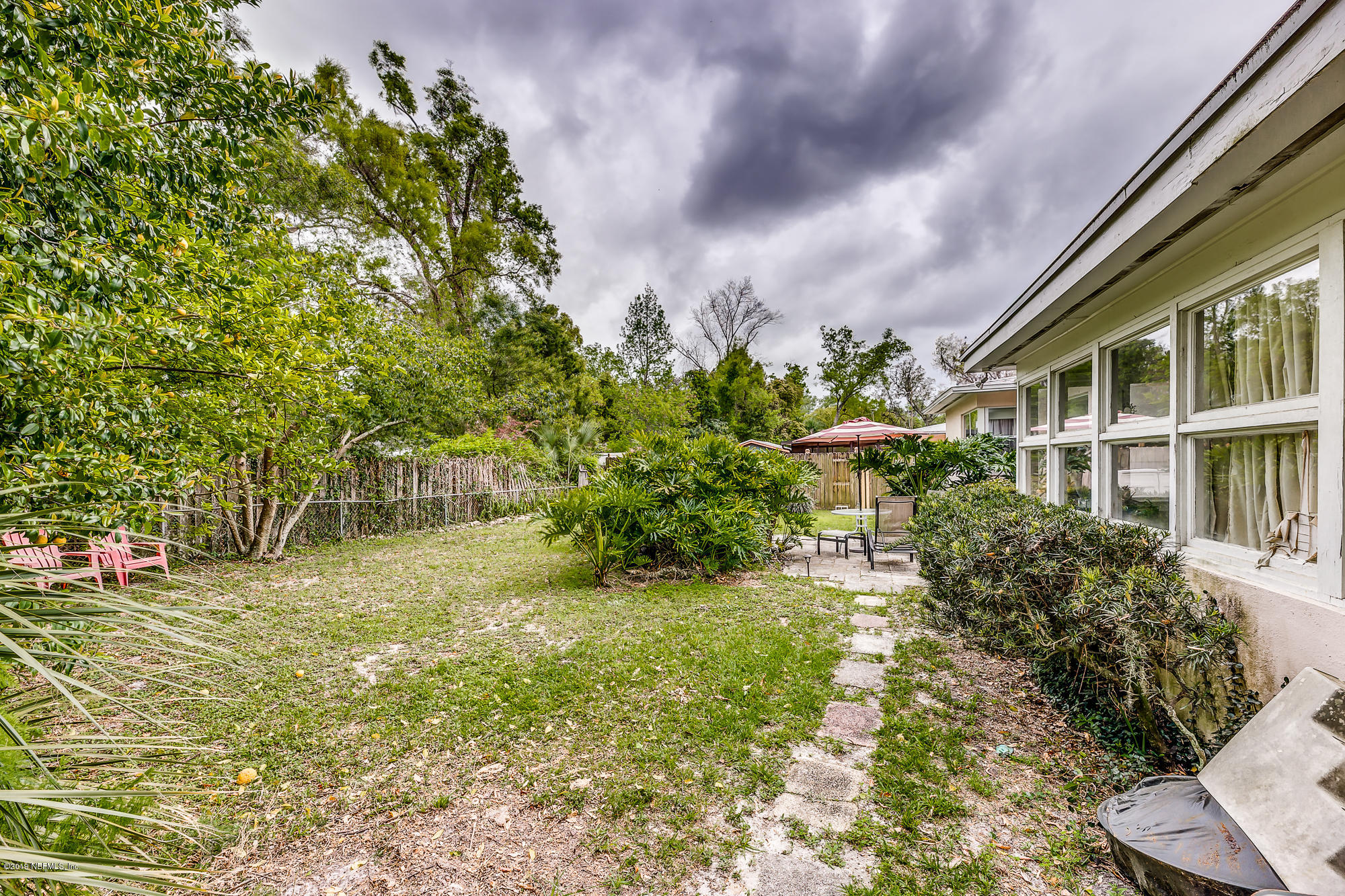 6403 Wesleyan Road Jacksonville, FL 32217 - Photo 6 of 37 a view of yard in front of house with trees