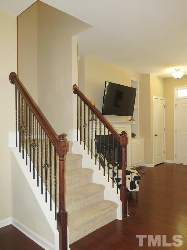 1314 Regulator Street Raleigh, NC 27603 - Photo 11 of 22 a view of entryway and hall with wooden floor