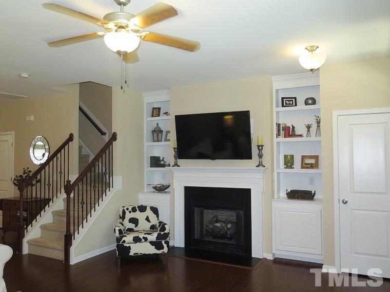 1314 Regulator Street Raleigh, NC 27603 - Photo 3 of 22 a living room with furniture fireplace and flat screen tv