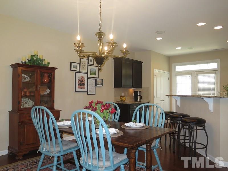 1314 Regulator Street Raleigh, NC 27603 - Photo 6 of 22 a view of a dining room with furniture and chandelier