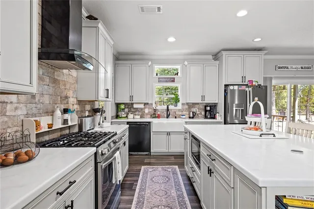 a white bath tub sitting next to a white sink