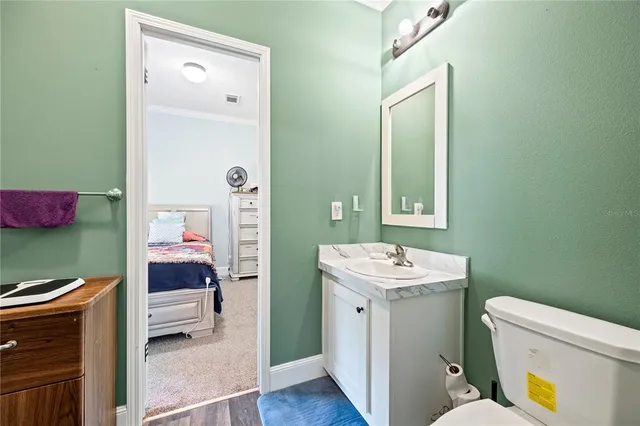 a backyard of a house with a yard and outdoor seating