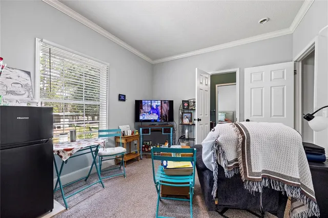 a view of backyard and wooden fence