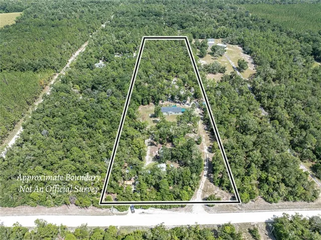 a bedroom with furniture and a flat screen tv
