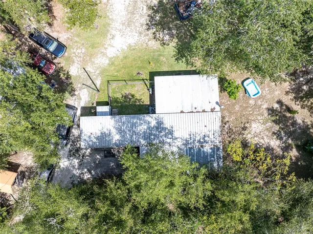 a view of walk in closet with clothes