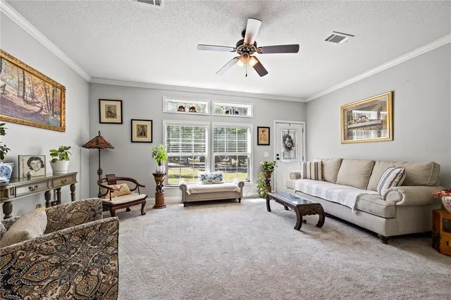 a kitchen with stainless steel appliances granite countertop a stove top oven a sink dishwasher and a refrigerator