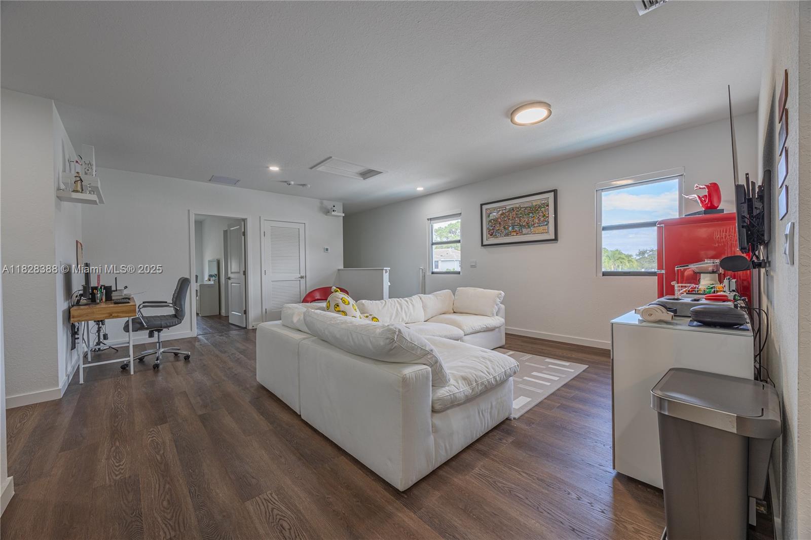 7126 Rockwood Road Jupiter, FL 33458 - Photo 17 of 30 a living room with furniture and a wooden floor