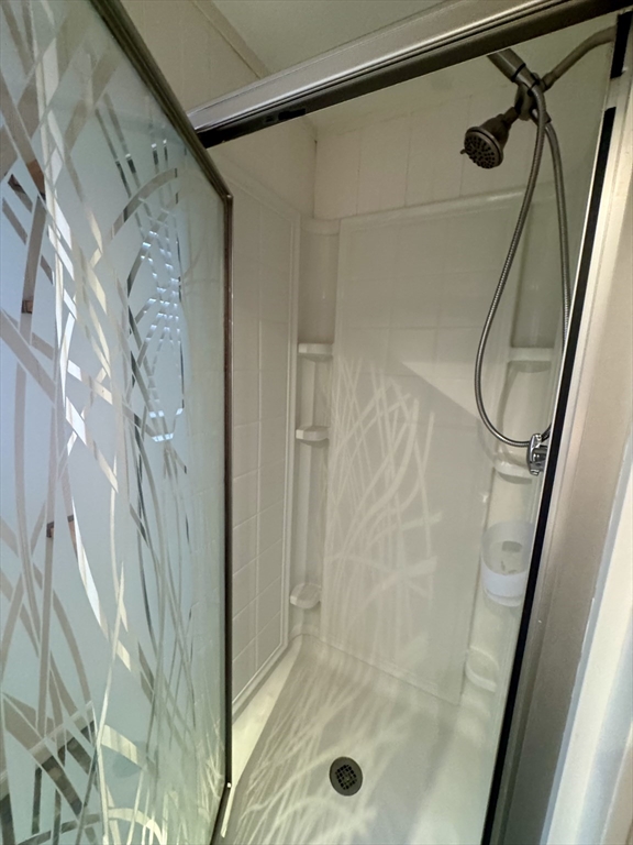 16 Winona Avenue Fairhaven, MA 02719 - Photo 15 of 22 a bathroom with a glass shower door