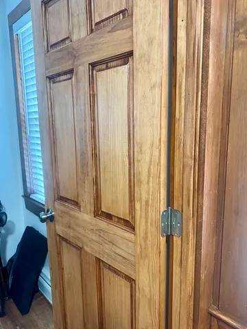 a view of a closet and a chair