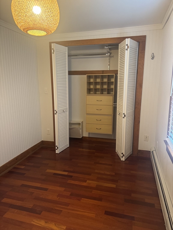 16 Winona Avenue Fairhaven, MA 02719 - Photo 20 of 22 an empty room with wooden floor and cabinet