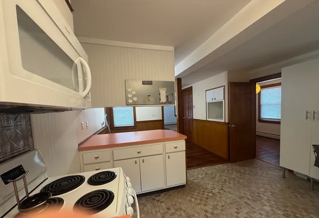 a room with a bed and a cabinets