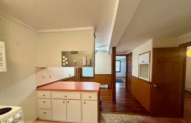 a hallway with wooden floor
