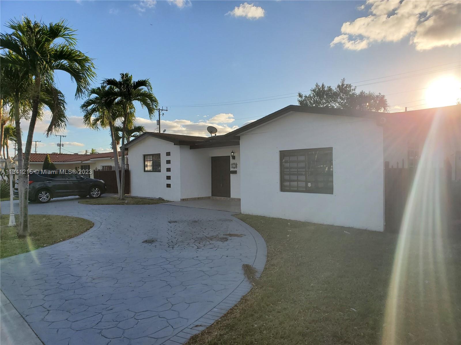 2120 Southwest 84th Avenue Miami, FL 33155 - Photo 2 of 8 a front view of a house with garden