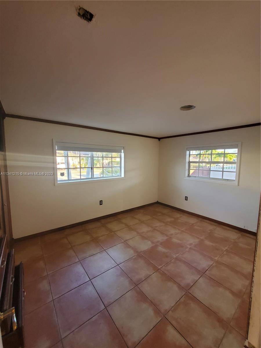 2120 Southwest 84th Avenue Miami, FL 33155 - Photo 6 of 8 a view of an empty room and a window