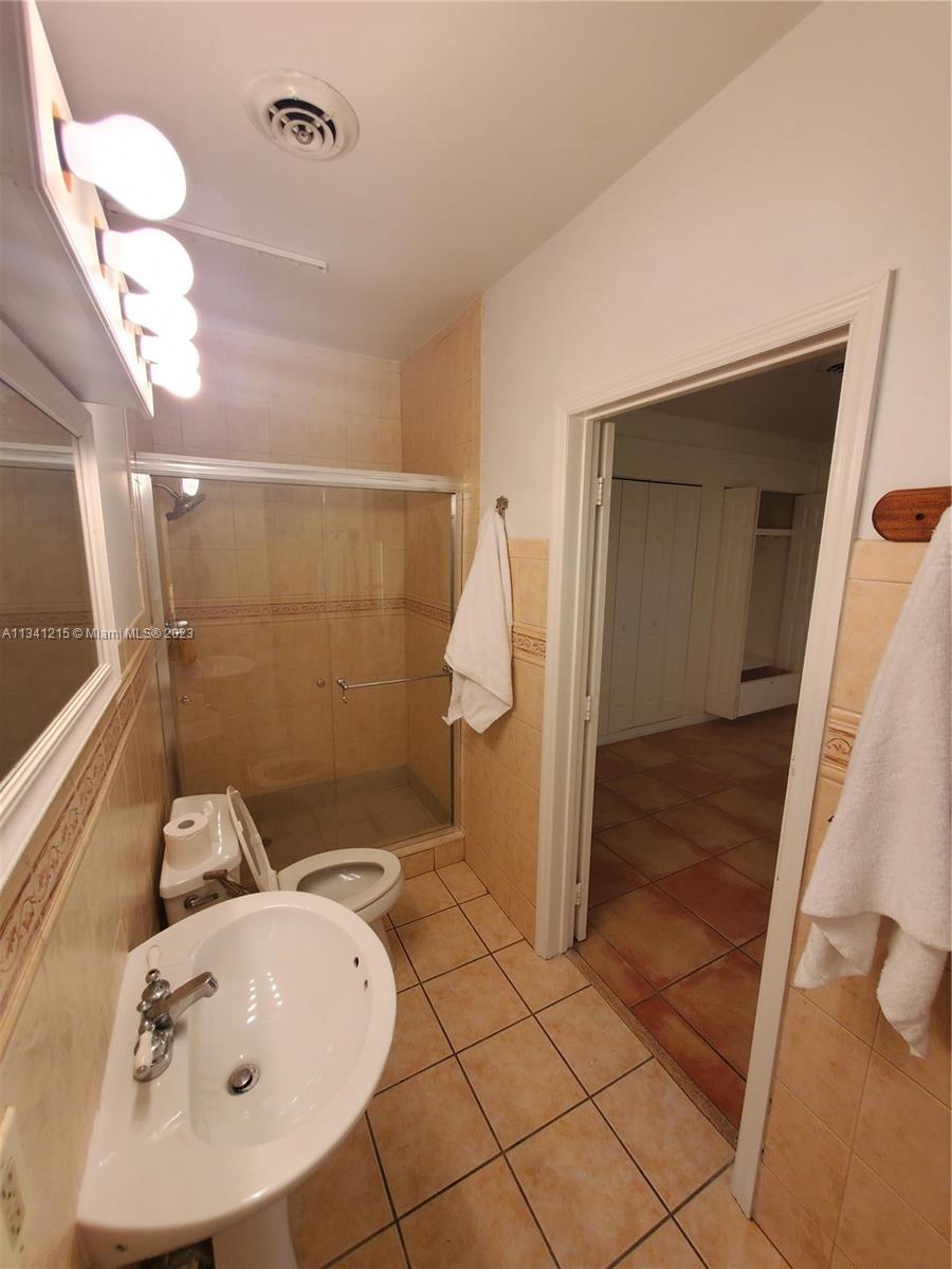 2120 Southwest 84th Avenue Miami, FL 33155 - Photo 7 of 8 a bathroom with a sink and mirror