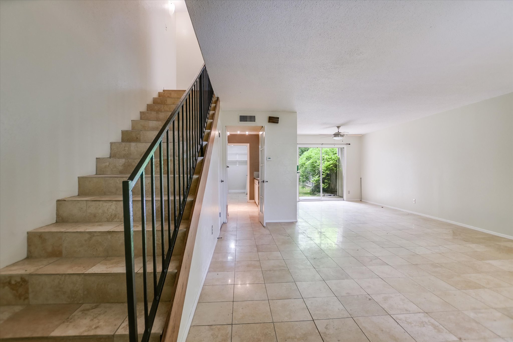 700 Castle Ridge Road, Unit C Austin, TX 78746 - Photo 2 of 10 a view of entryway and hall with wooden floor