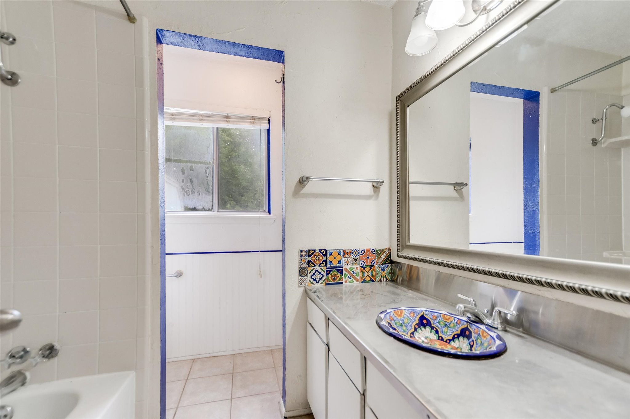 700 Castle Ridge Road, Unit C Austin, TX 78746 - Photo 9 of 10 a kitchen with furniture and a window
