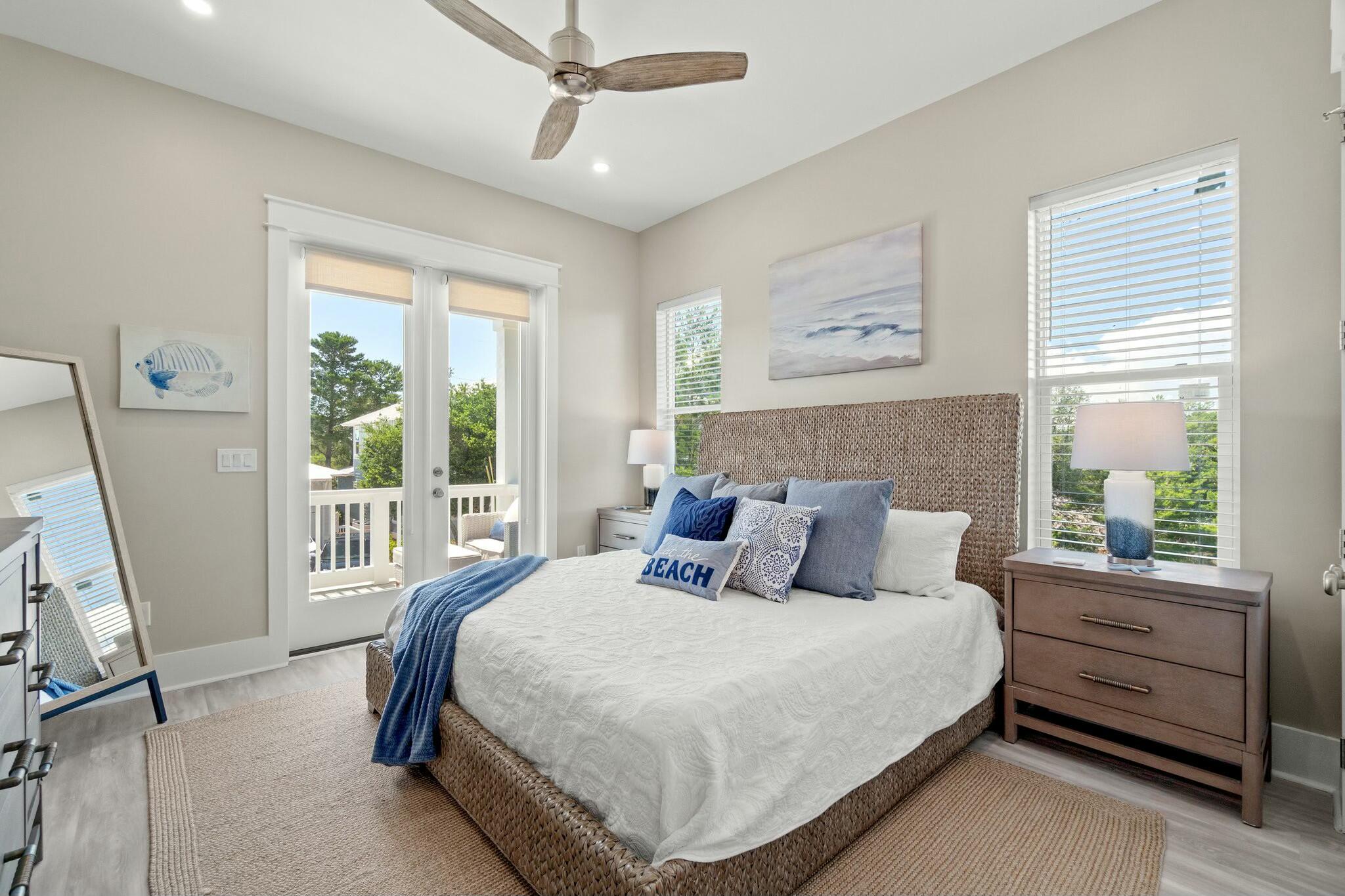 566 Gulfview Circle Santa Rosa Beach, FL 32459 - Photo 28 of 38 a bedroom with a large bed and a window