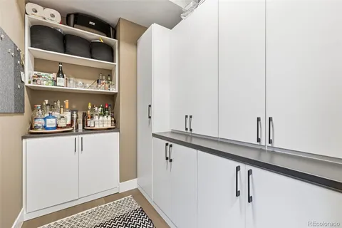 a view of cabinets and wooden floor