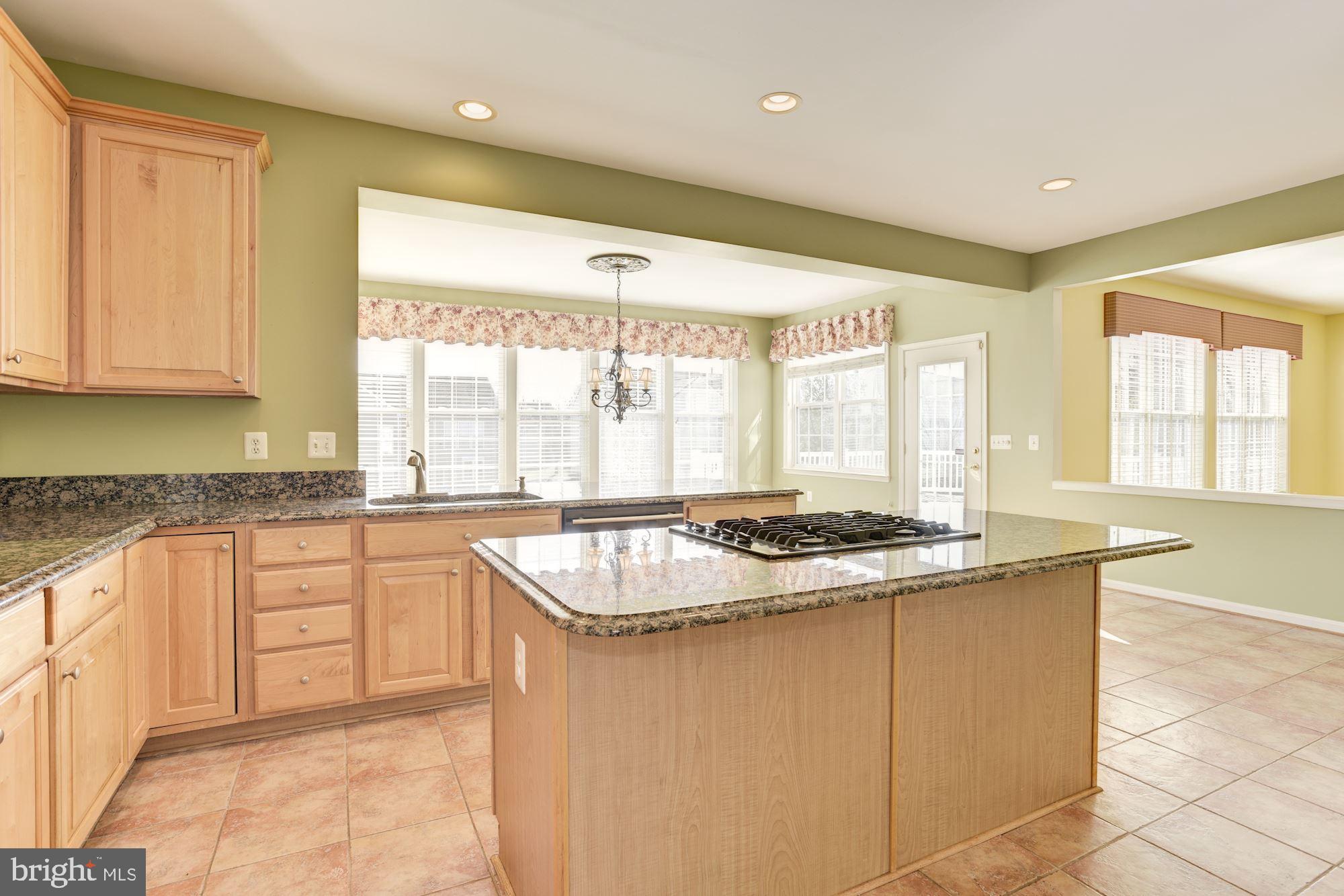 12335 Wake Forest Road Clarksville, MD 21029 - Photo 14 of 60 Spacious Kitchen with Granite Counters and Island