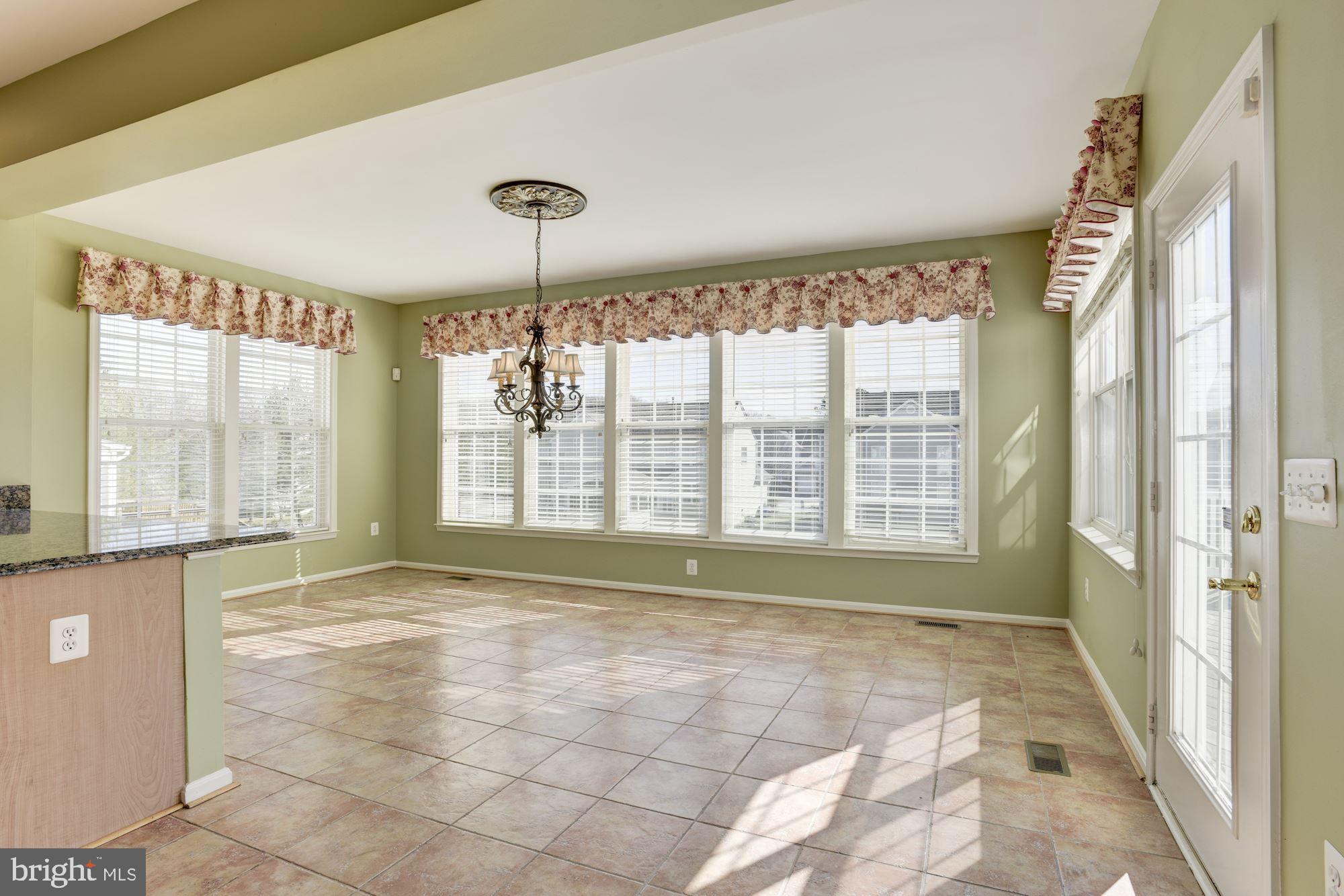 12335 Wake Forest Road Clarksville, MD 21029 - Photo 19 of 60 Sun Room with Walls of Windows and Door to Deck