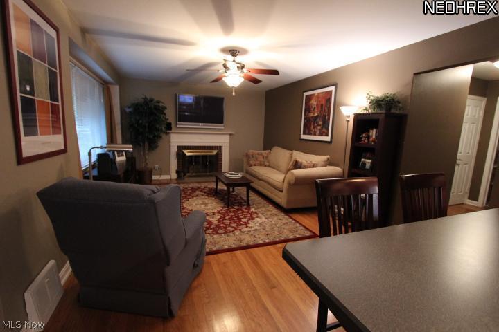 1616 Edgefield Road Lyndhurst, OH 44124 - Photo 2 of 11 Living room features wood burning fireplace and beautiful hardwood floors