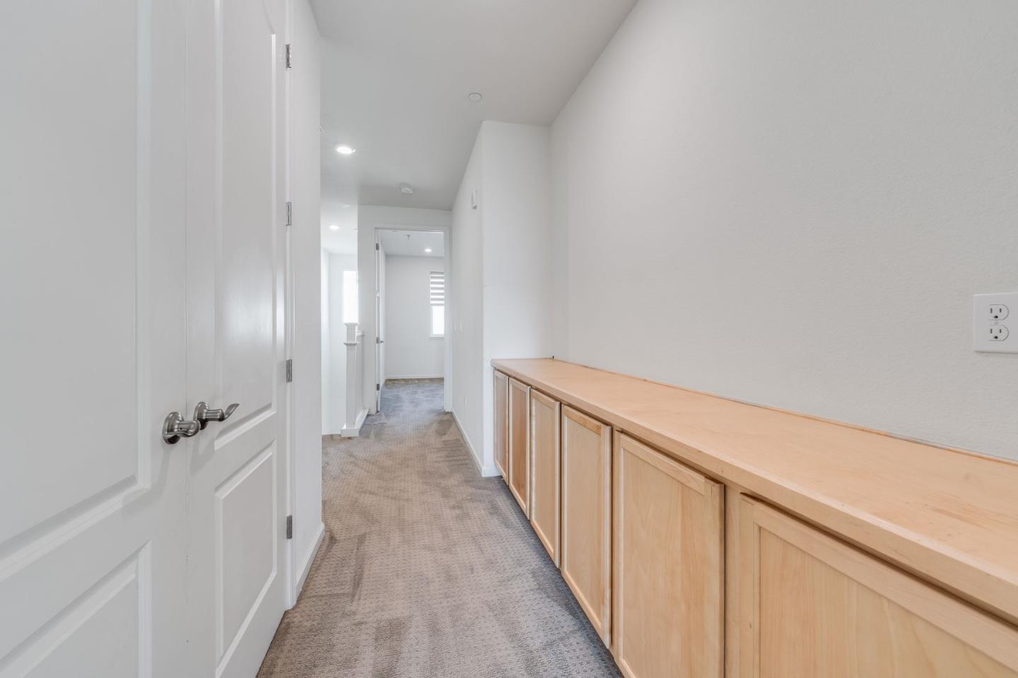 6914 Geyserville Street Dublin, CA 94568 - Photo 23 of 43 a view of a hallway with wooden floor and closet