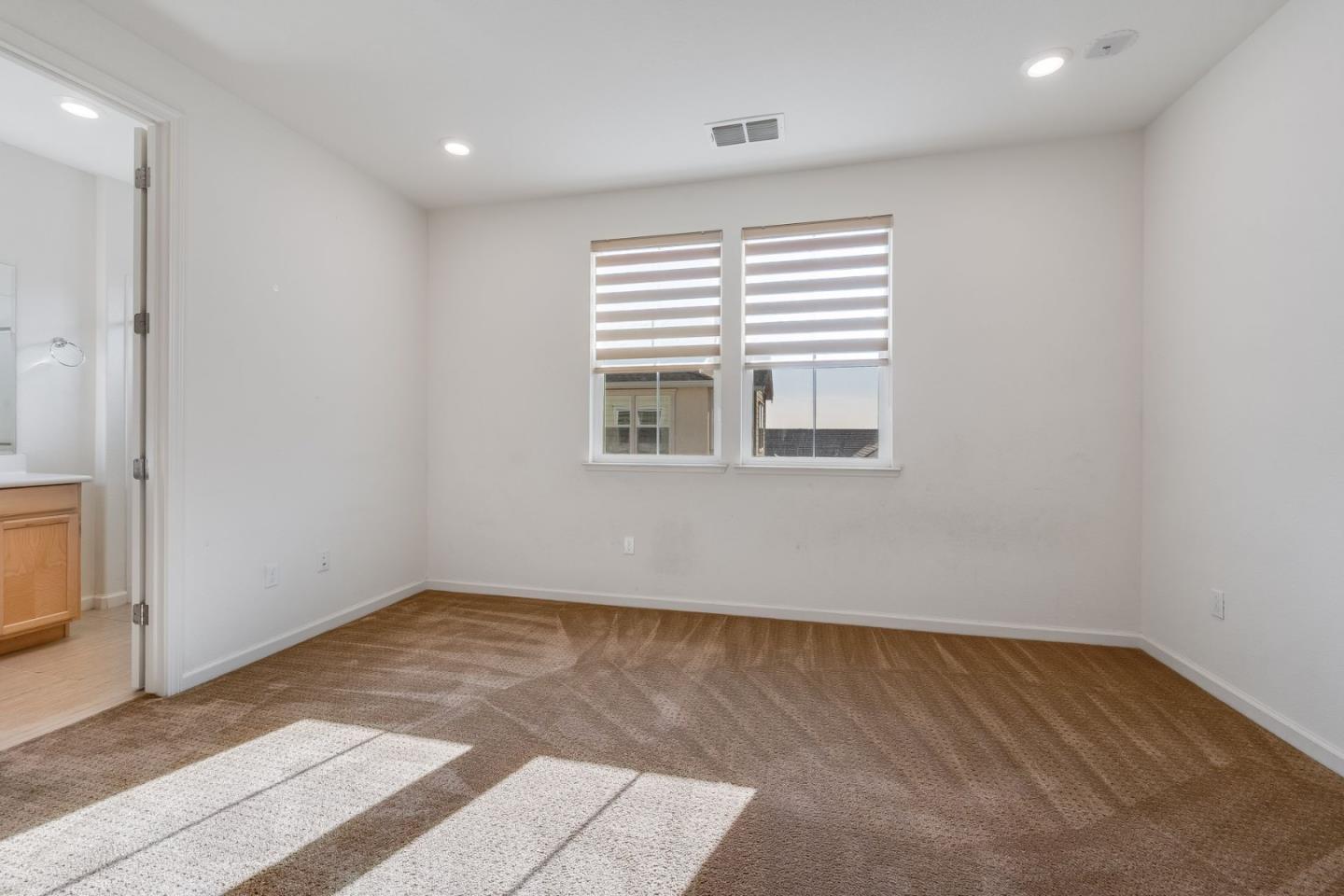 6914 Geyserville Street Dublin, CA 94568 - Photo 24 of 43 a view of an empty room with wooden floor and a window
