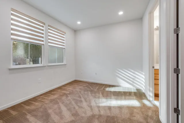 a view of empty room with windows