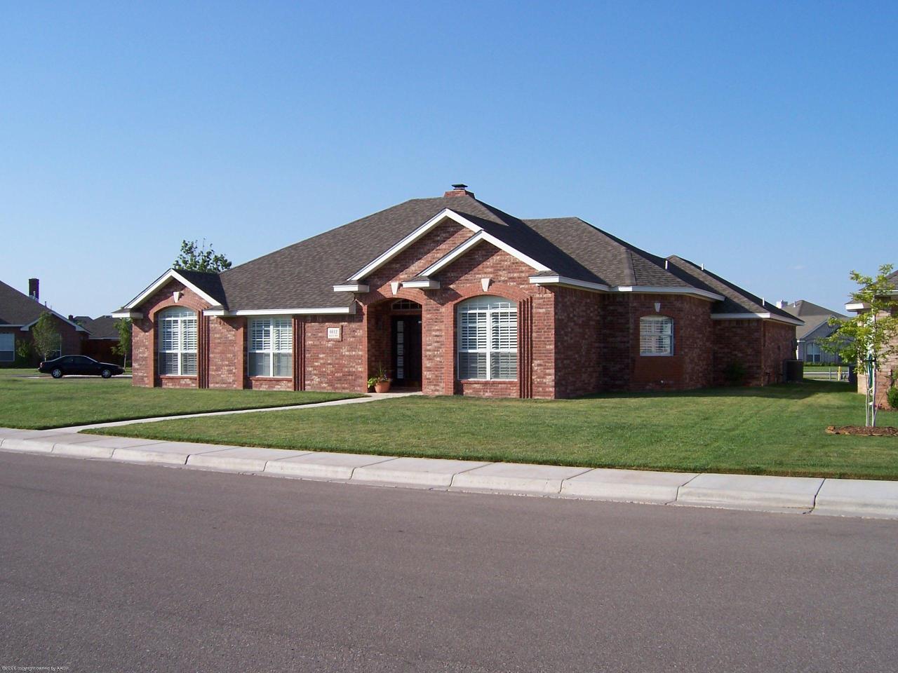 6612 Rally Road Amarillo, TX 79119 - Photo 1 of 1 a front view of a house with a yard and garage