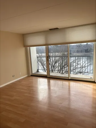 a view of an empty room with a window