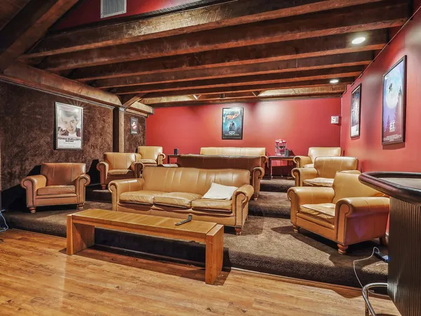 a living room with furniture and a rug