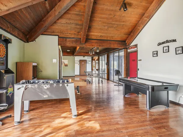 a room with gym equipment and a large window