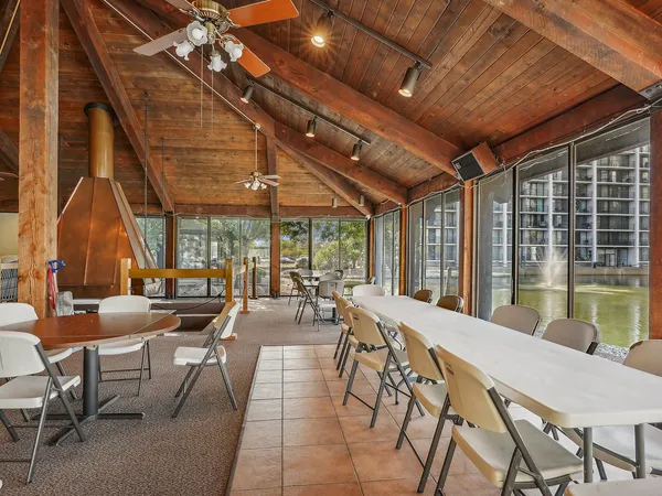 a outdoor space with lots of furniture and wooden floor