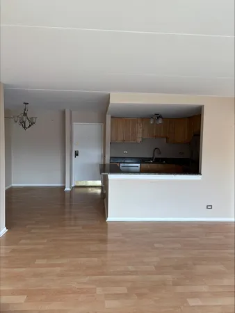 a view of a livingroom with an empty space and a fireplace