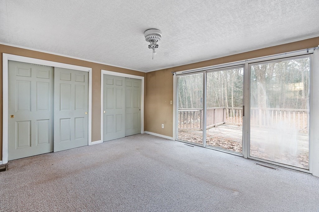 146 Riceville Road Athol, MA 01331 - Photo 21 of 42 a view of an empty room with a sliding door
