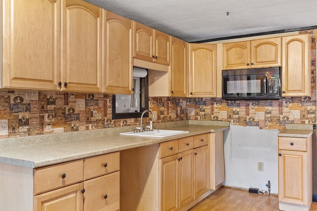 146 Riceville Road Athol, MA 01331 - Photo 4 of 42 a kitchen with stainless steel appliances granite countertop a sink a stove and cabinets