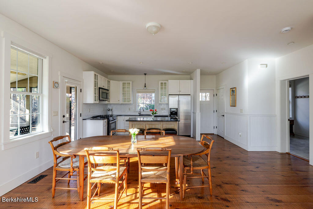 165 D Maple Avenue Great Barrington, MA 01230 - Photo 11 of 32 a view of a dining room with furniture and wooden floor