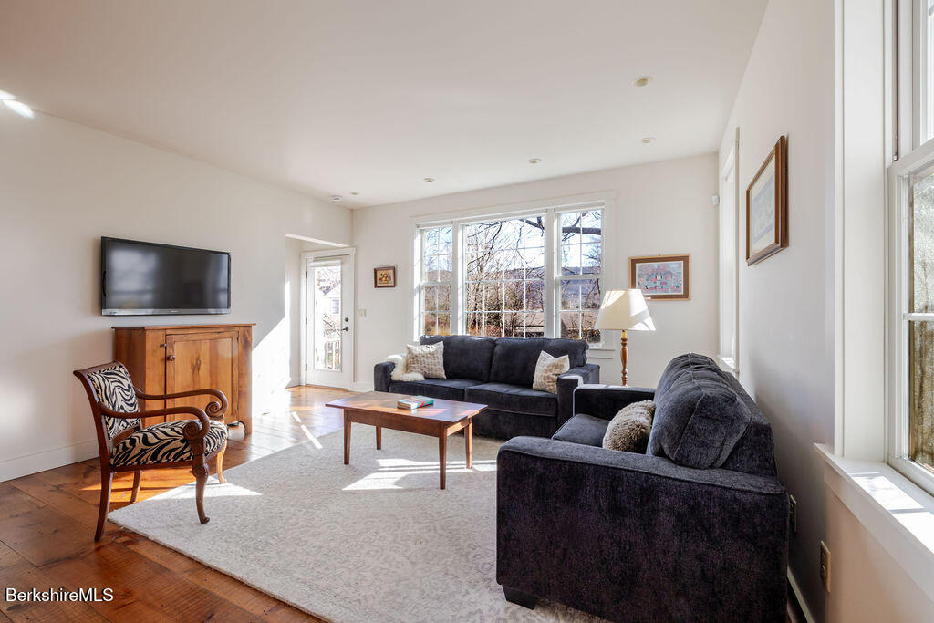 165 D Maple Avenue Great Barrington, MA 01230 - Photo 13 of 32 a living room with furniture and a flat screen tv