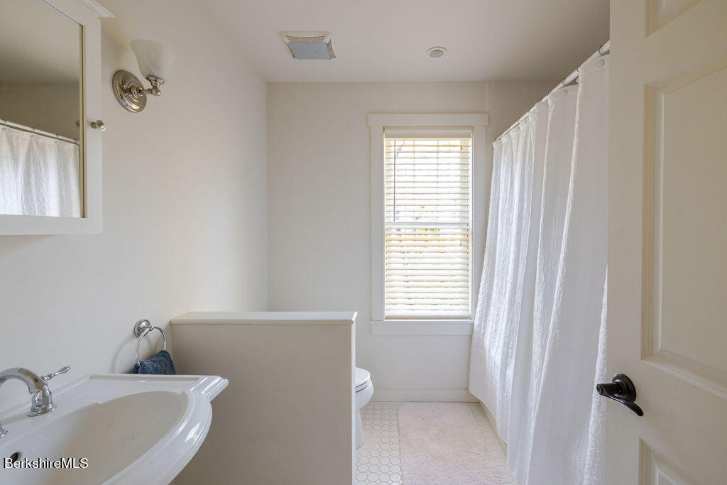165 D Maple Avenue Great Barrington, MA 01230 - Photo 26 of 32 a bathroom with a sink and a tub