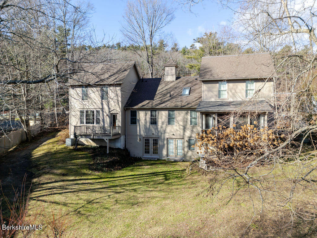 165 D Maple Avenue Great Barrington, MA 01230 - Photo 31 of 32 a view of a house with a yard