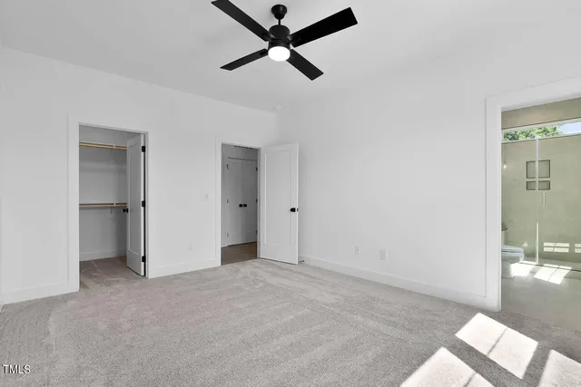 a bathroom with a sink toilet a mirror and shower