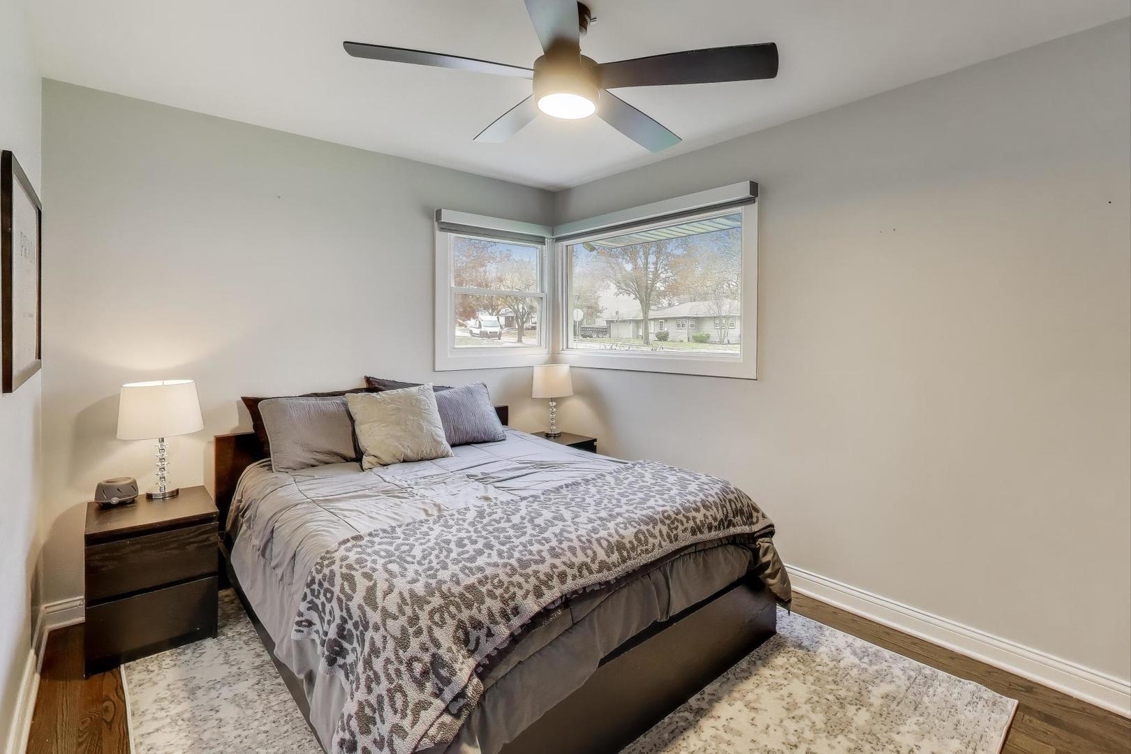 591 South Park Road Lombard, IL 60148 - Photo 11 of 30 a bedroom with a bed and a chandelier