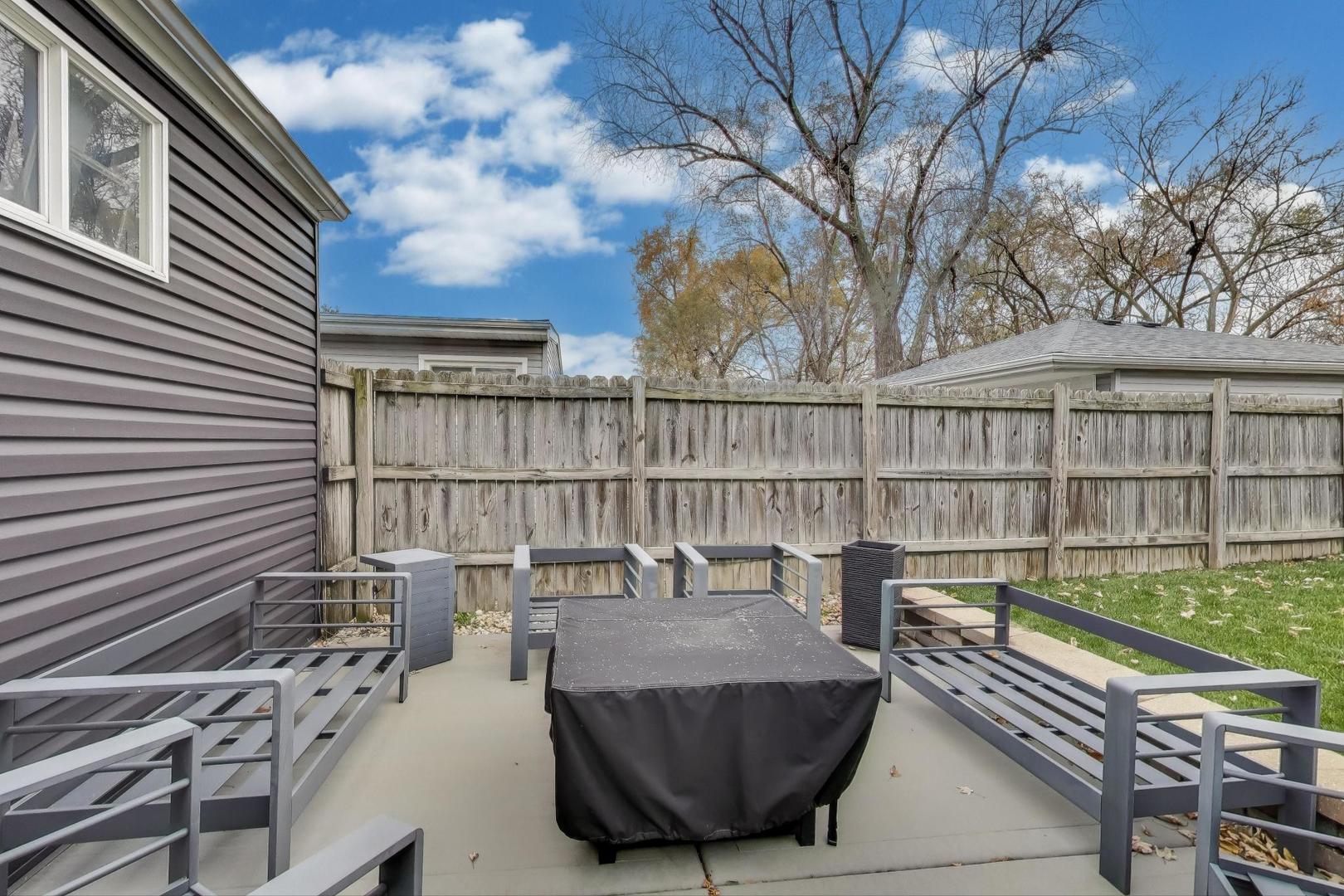 591 South Park Road Lombard, IL 60148 - Photo 27 of 30 a view of a balcony with wooden floor and fence