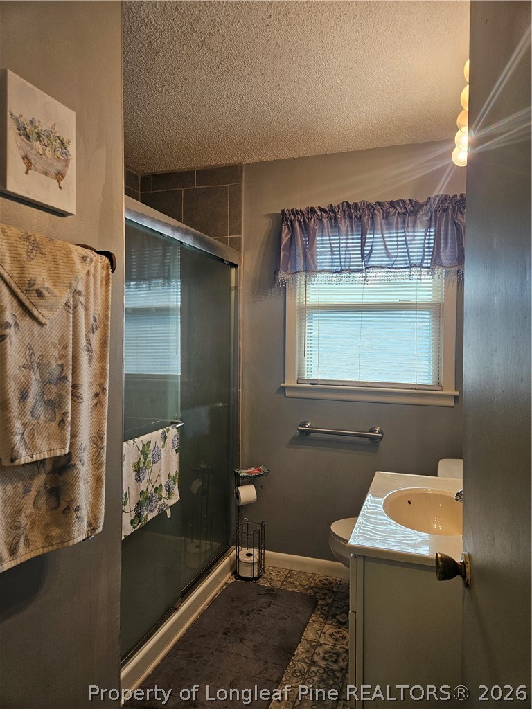 4547 Legion Road Hope Mills, NC 28348 - Photo 17 of 28 a bathroom with a sink and mirror